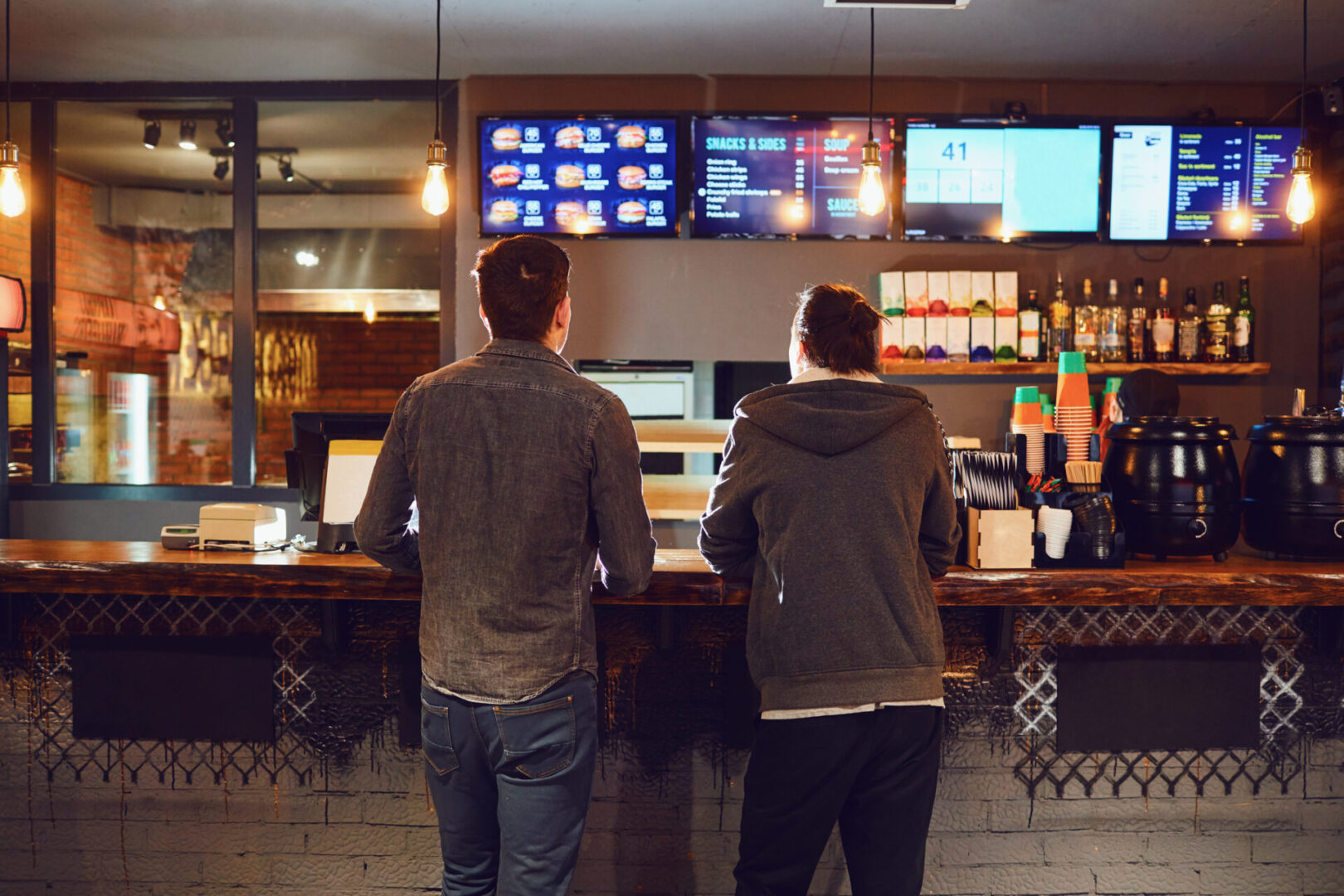 Customers at a modern cafe counter