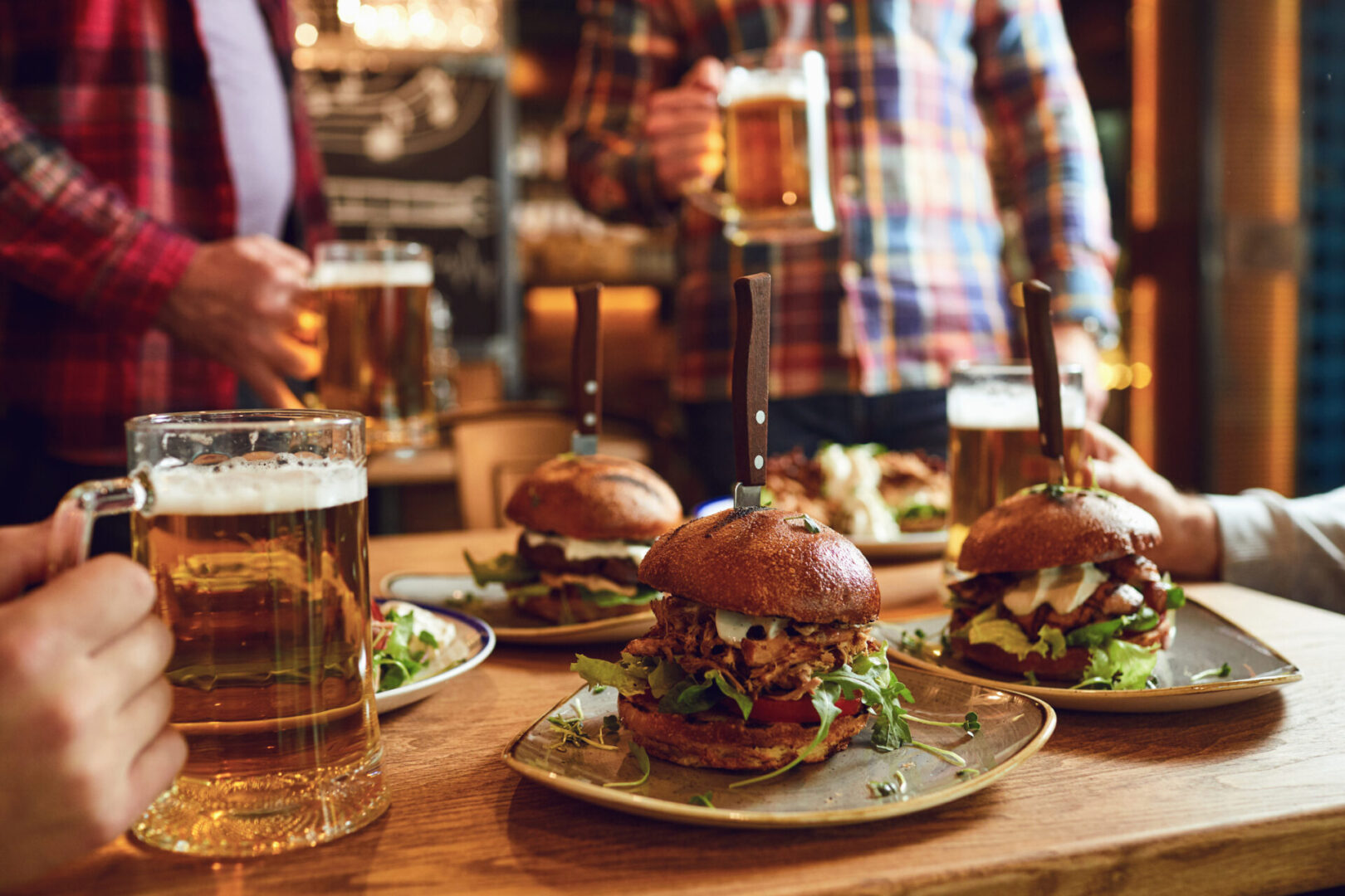 Burgers and beer on a wooden table