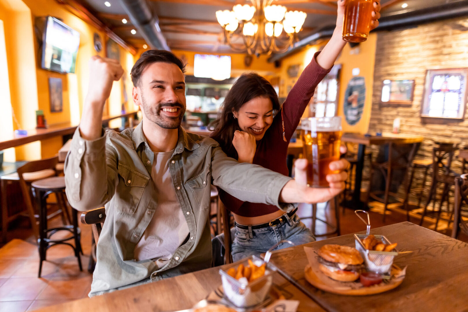 Friends celebrating in a lively pub