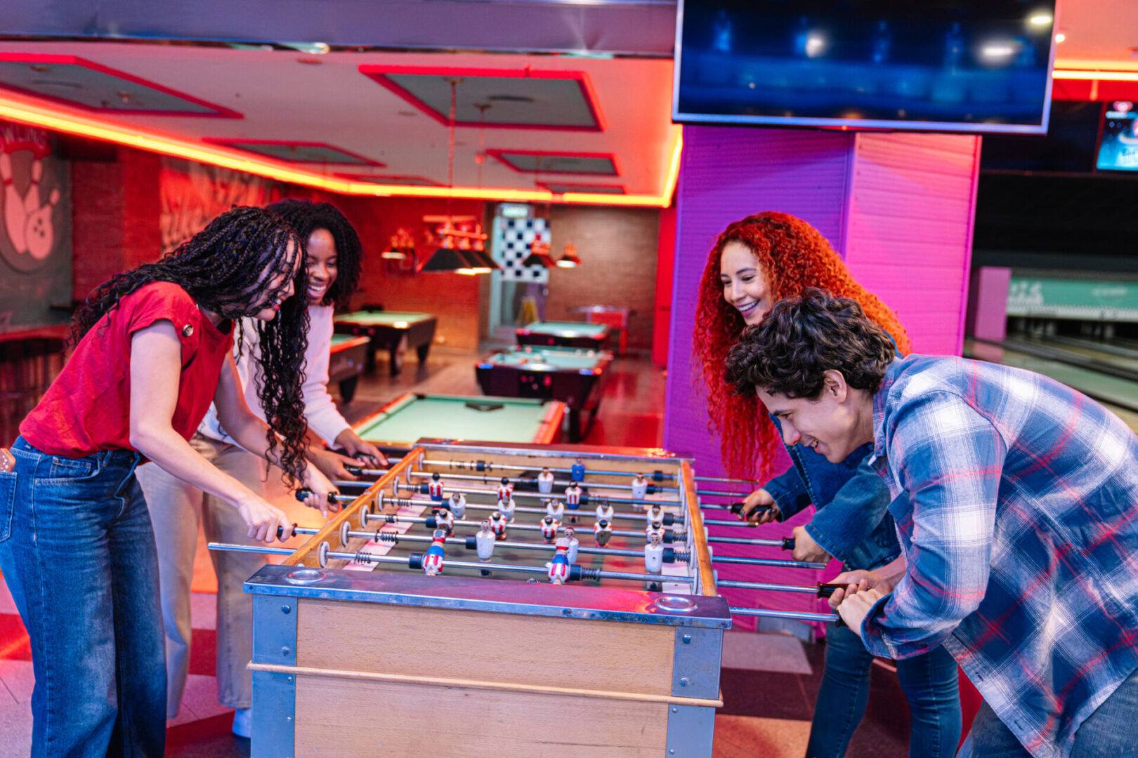 Group enjoying foosball game